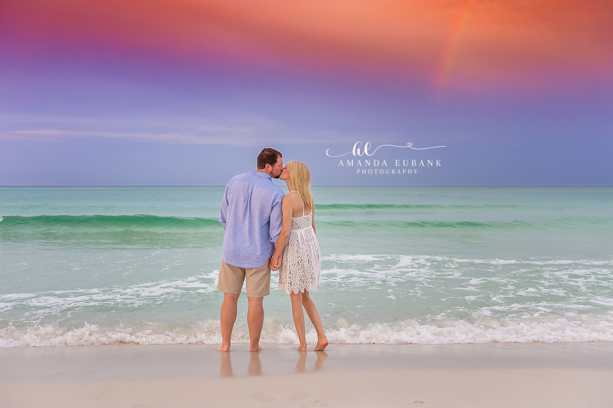 Engaged Couple Holding Hands in the Surf | Tampa Beach Engagement Photography Tampa engagement photographer captures an engaged couple holding hands in the shallow surf as pastel light fades over turquoise water.