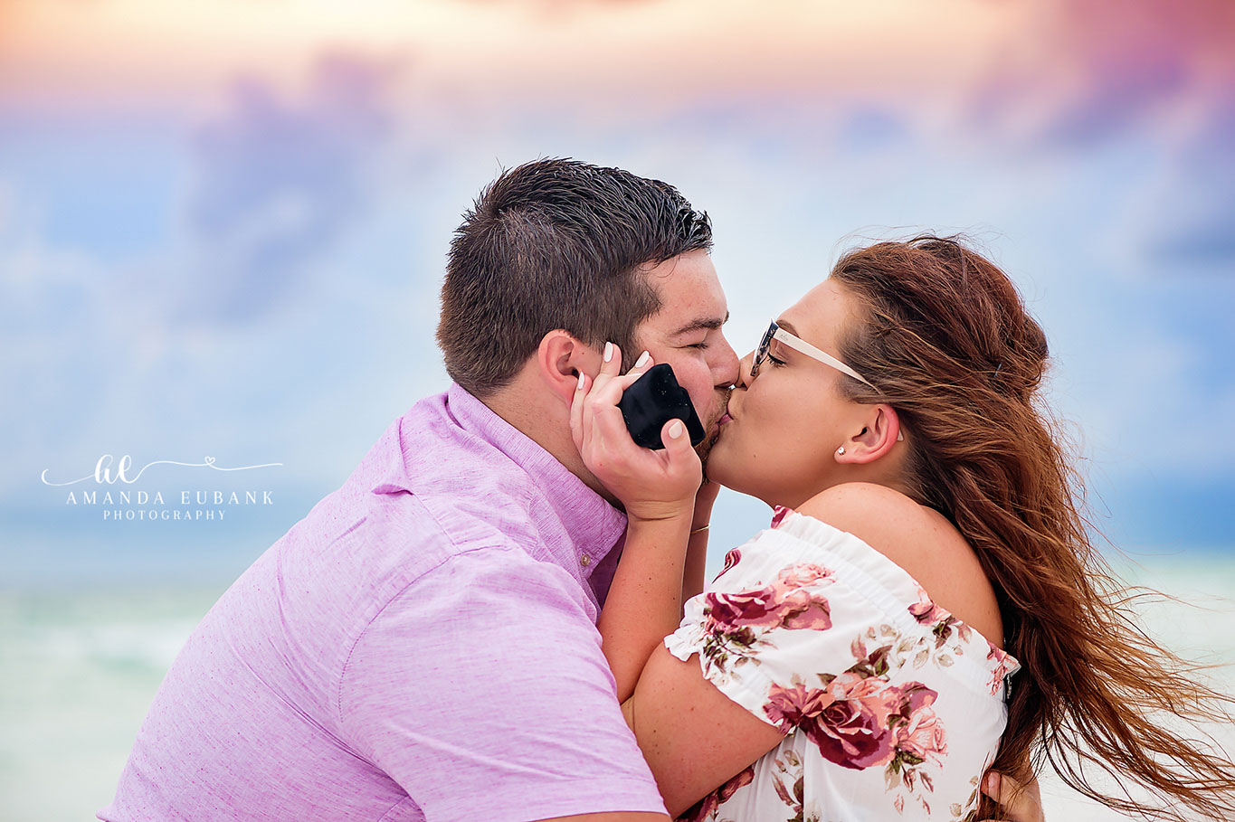 Windblown Kiss Close-Up — Tampa, FL Engagement Session A close-up of a couple kissing with her hair caught in the ocean breeze at a Gulf beach engagement session near Tampa, Florida.