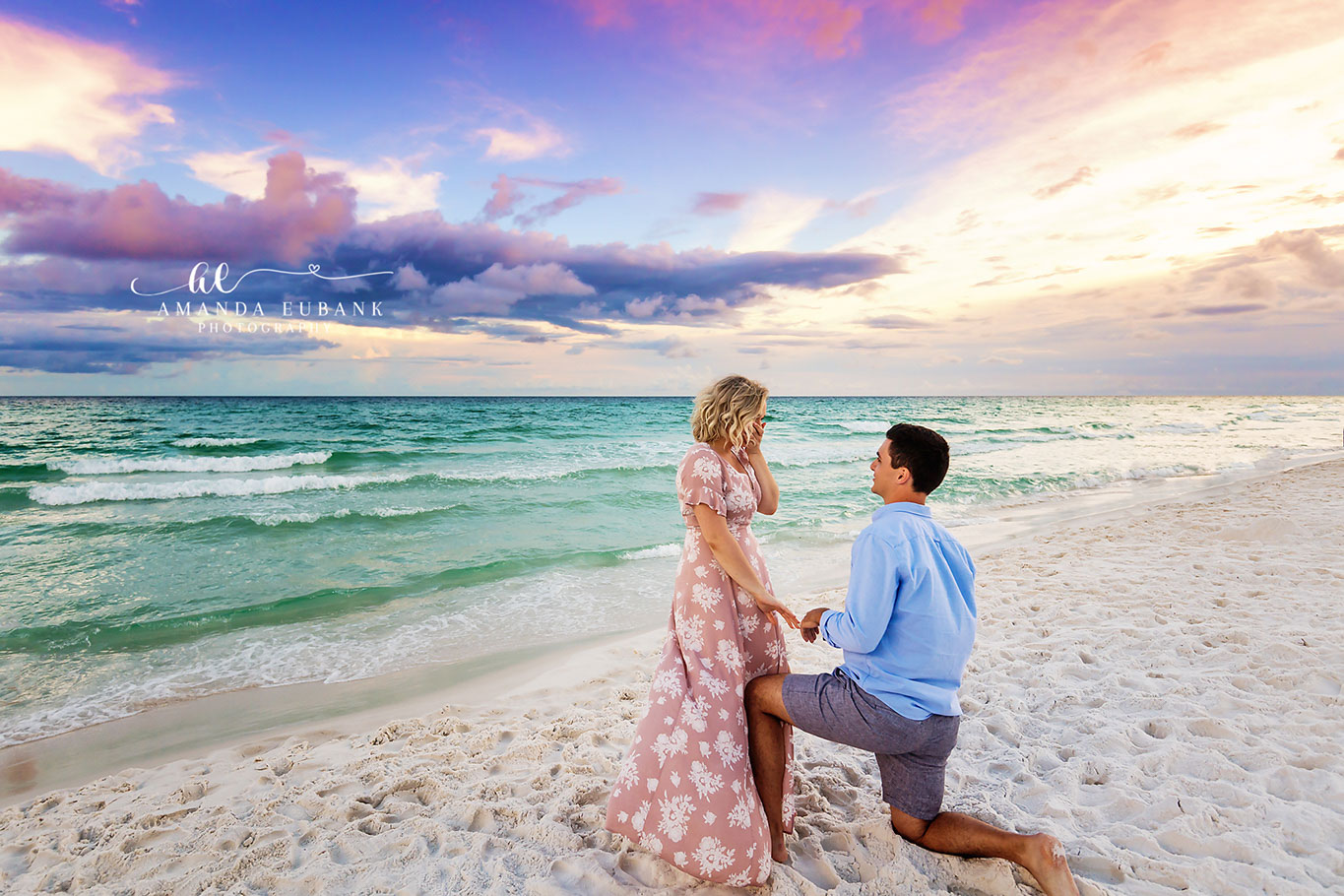 Surprise Proposal on White Sand | Engagement Photographer in Tampa, Florida Engagement photos in Tampa, FL showing a surprise proposal on white sand with the turquoise Gulf stretching behind them.