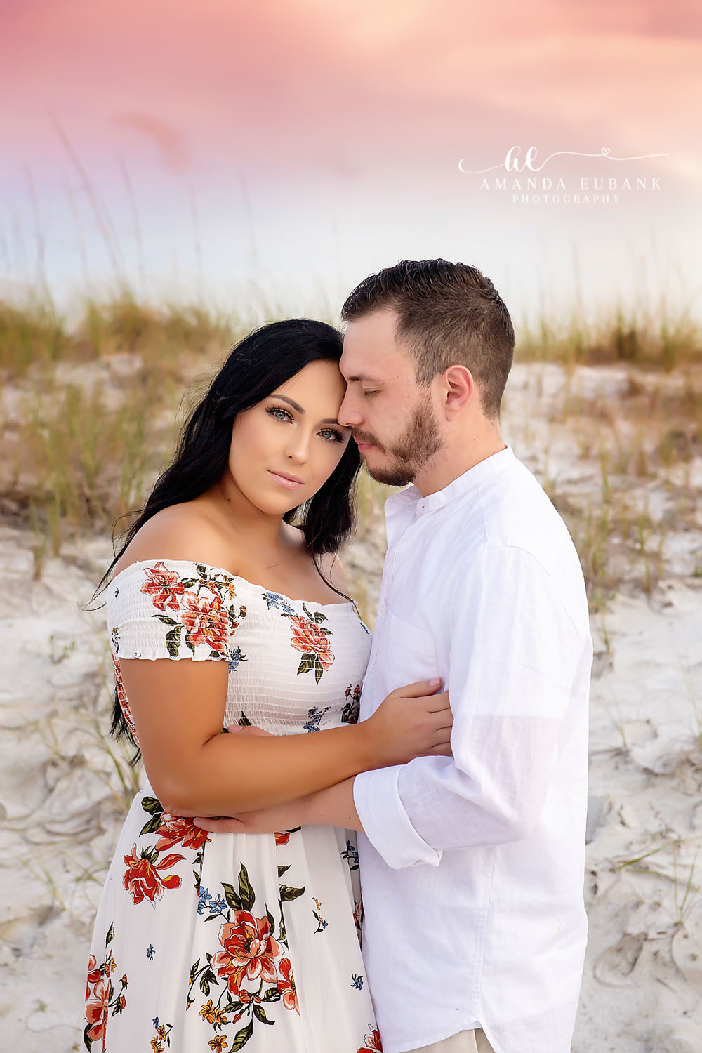 Quiet Moment by the Dunes | Tampa Beach Engagement Photography Tampa engagement photographer captures a couple standing quietly together beside the sea oats in soft evening light.