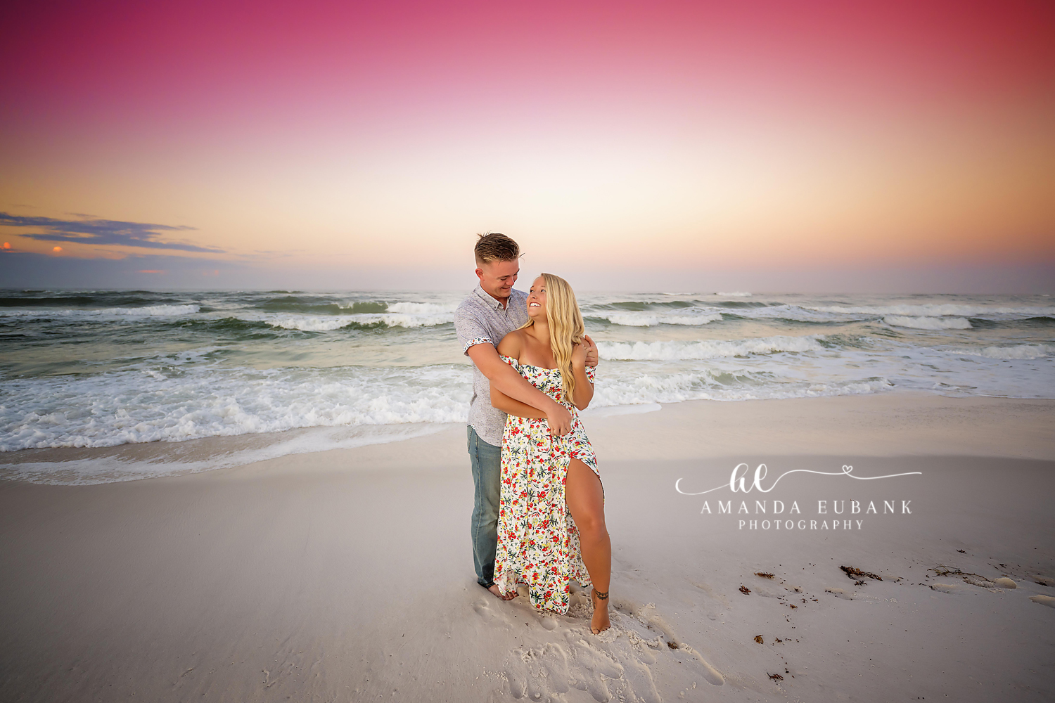 Embrace on the Wet Sand | Tampa Beach Engagement Photography Tampa engagement photographer captures a couple holding each other on the wet sand as the horizon glows behind them.