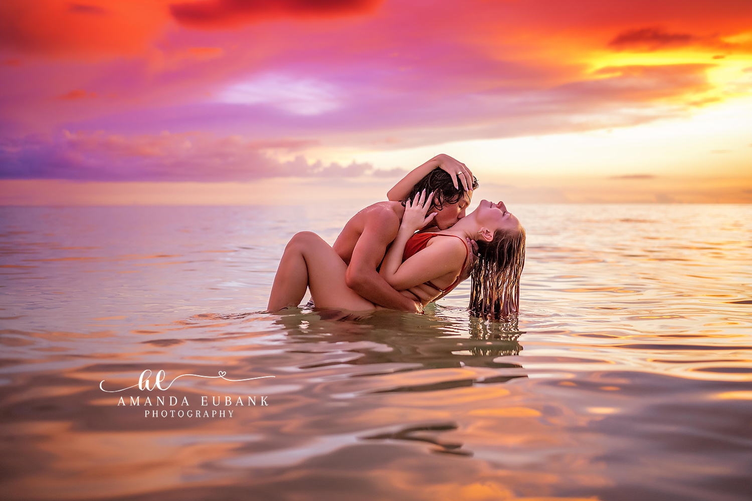 Wet Sand Embrace at Dusk | Tampa Beach Engagement Photography Tampa engagement photographer captures a couple embracing in the shallow water with the last purple light overhead.