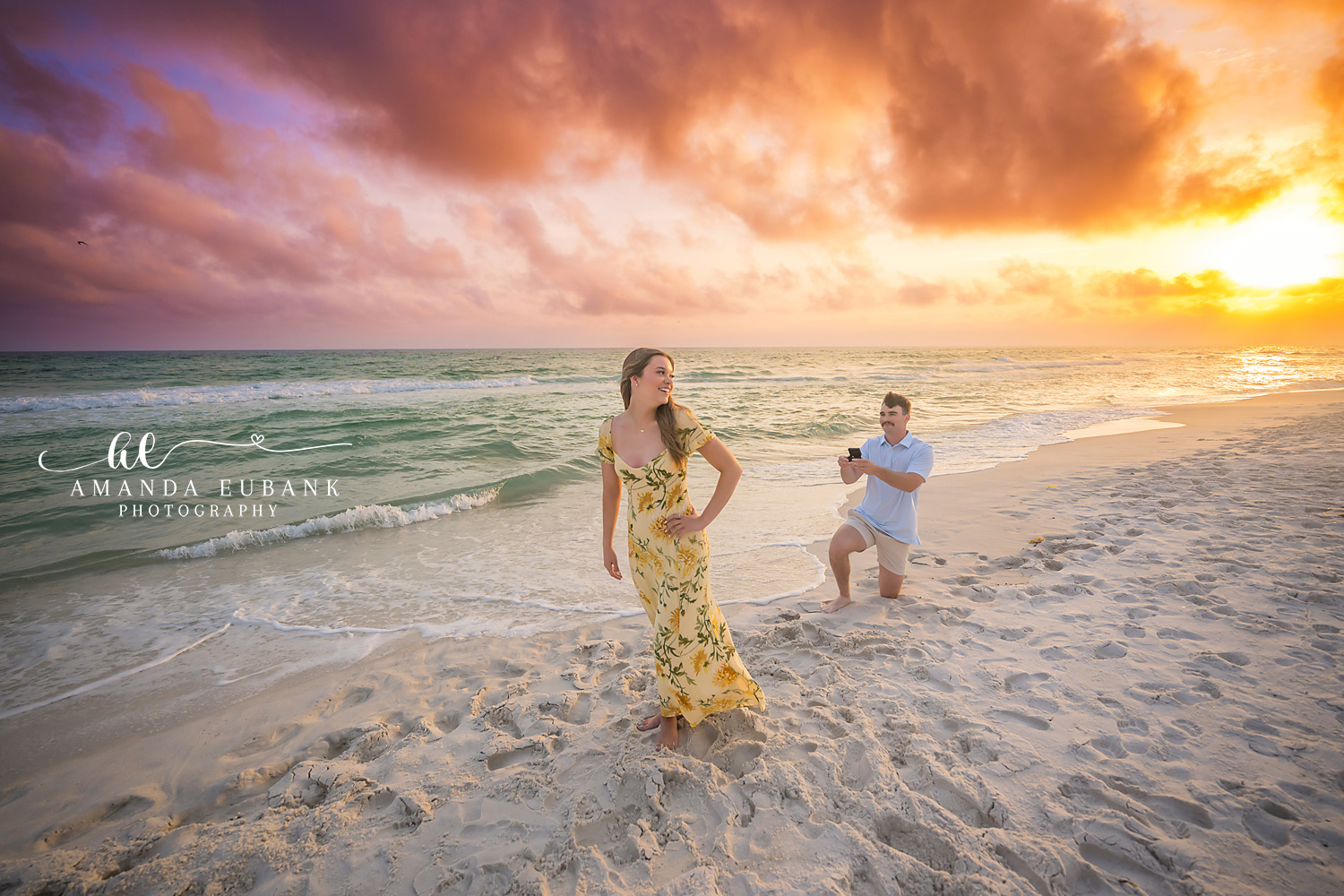 The Yes Moment at Sunset | Engagement Photographer in Tampa, Florida Engagement photos in Tampa, FL showing her hands flying up in surprise as he proposes against a blazing orange horizon.