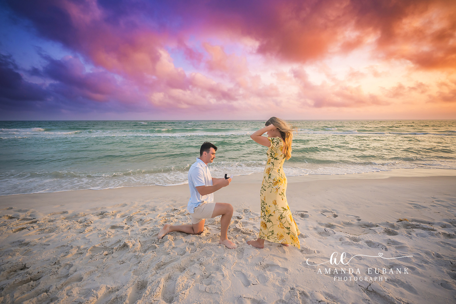 Overcome by the Question | Tampa Beach Engagement Photography Tampa engagement photographer captures her hands in her hair as the proposal unfolds above the emerald Gulf.