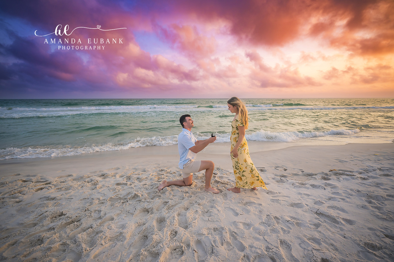 Proposal on the Wet Sand — Tampa Bay Engagement Photography An open ring box offered on the wet sand under a coral and purple sky — beach engagement photography in Tampa Bay.