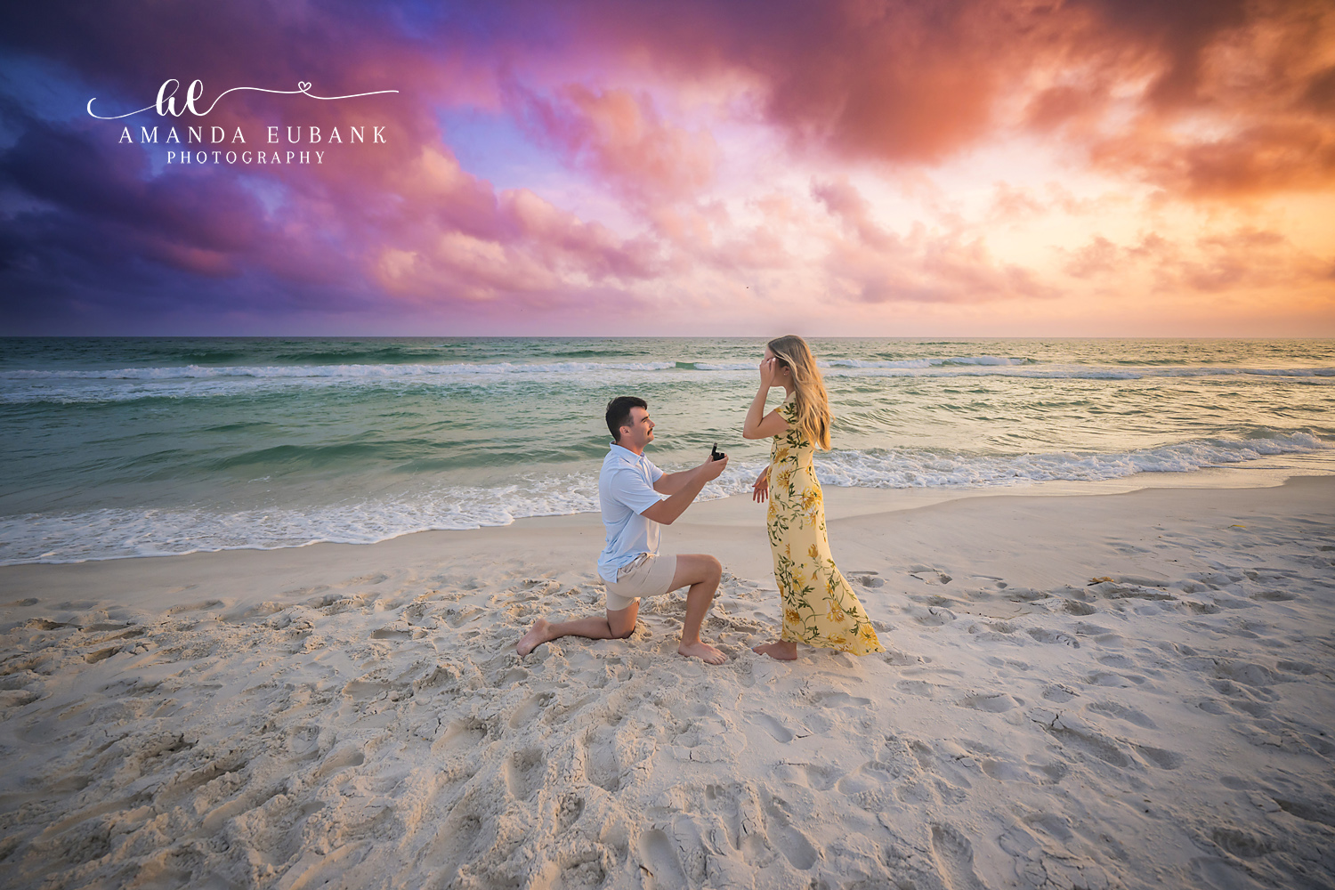Happy Tears at Sunset | Tampa Engagement Photographer She covers her face with joy while he waits on one knee in the sand during a Tampa engagement photography session.