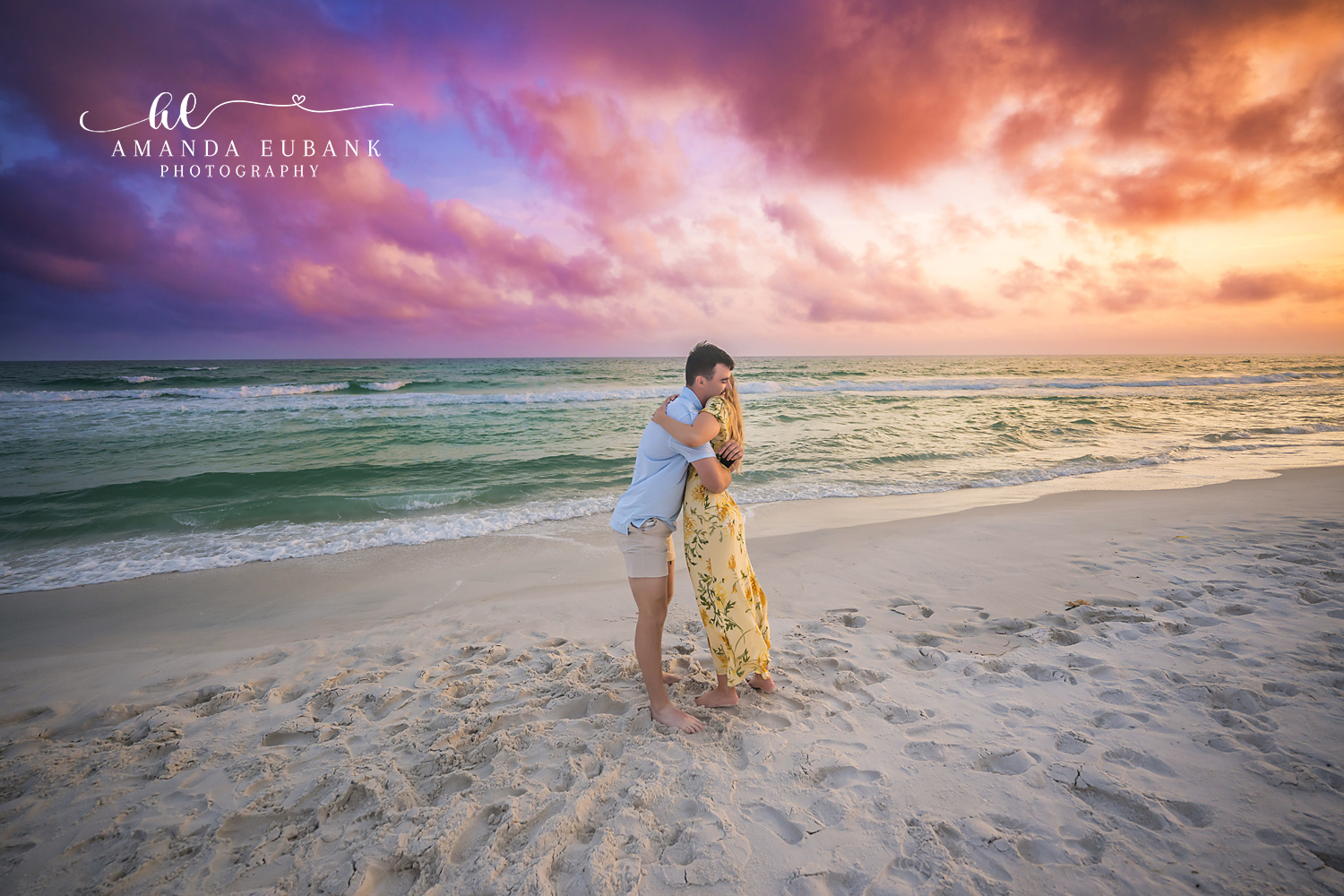 First Embrace as Fiances — Tampa Bay Engagement Photography A newly engaged couple's first embrace, backs to the camera, facing the Gulf — beach engagement photography in Tampa Bay.