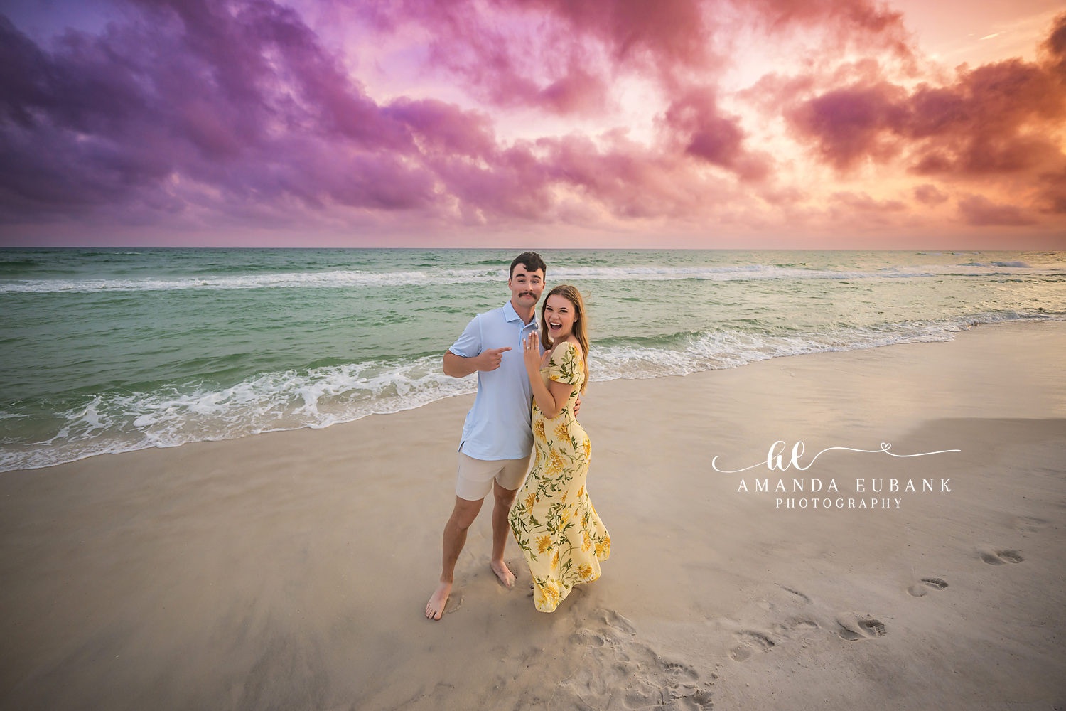 Laughing Through the Surf | Engagement Photographer in Tampa, Florida Engagement photos in Tampa, FL showing a couple laughing as they walk through the surf with her yellow dress lifting.