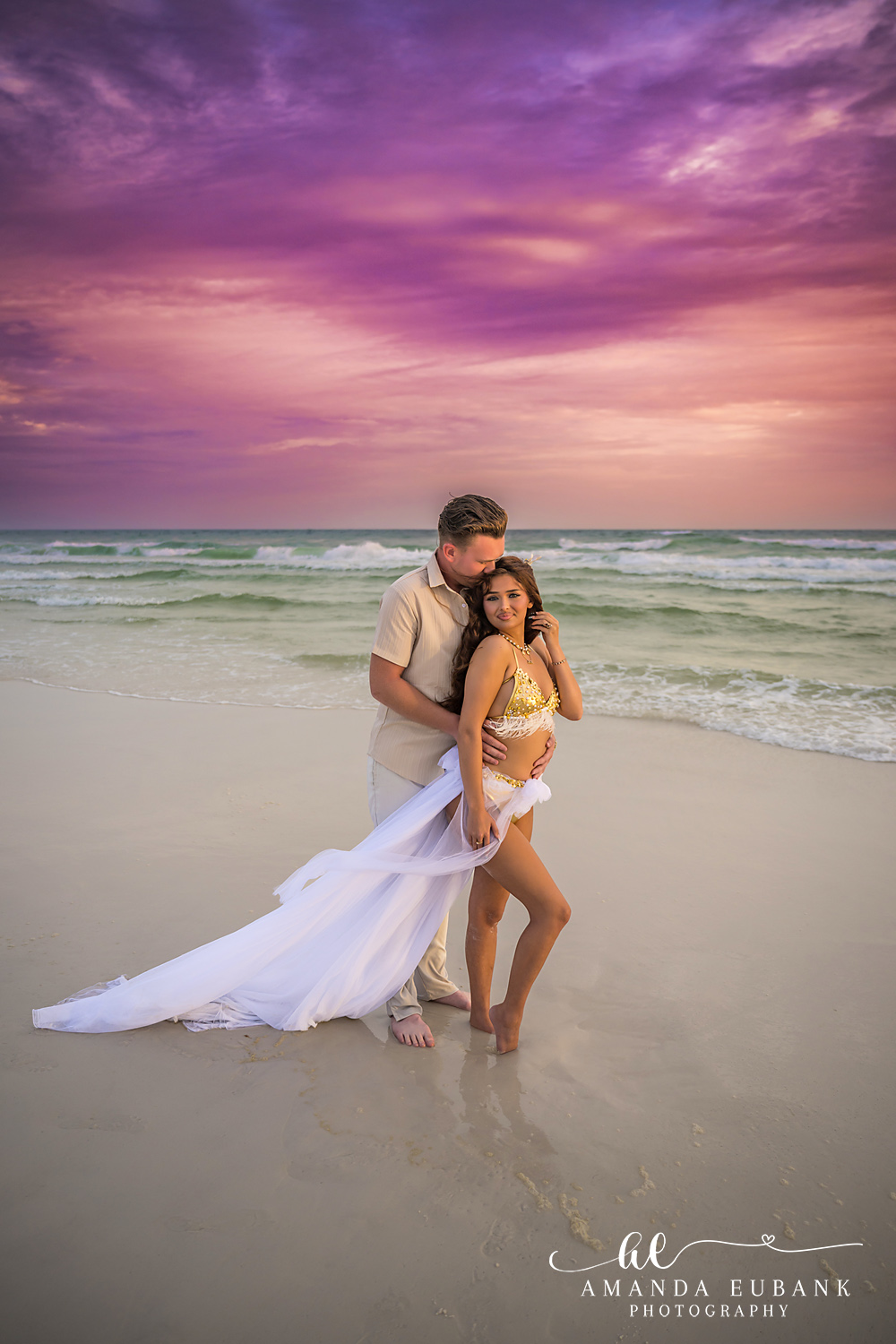 Fanned Train in the Water | Tampa Engagement Photographer A couple standing in the shallows with her gown fanned out across the surface during a Tampa engagement photography session.