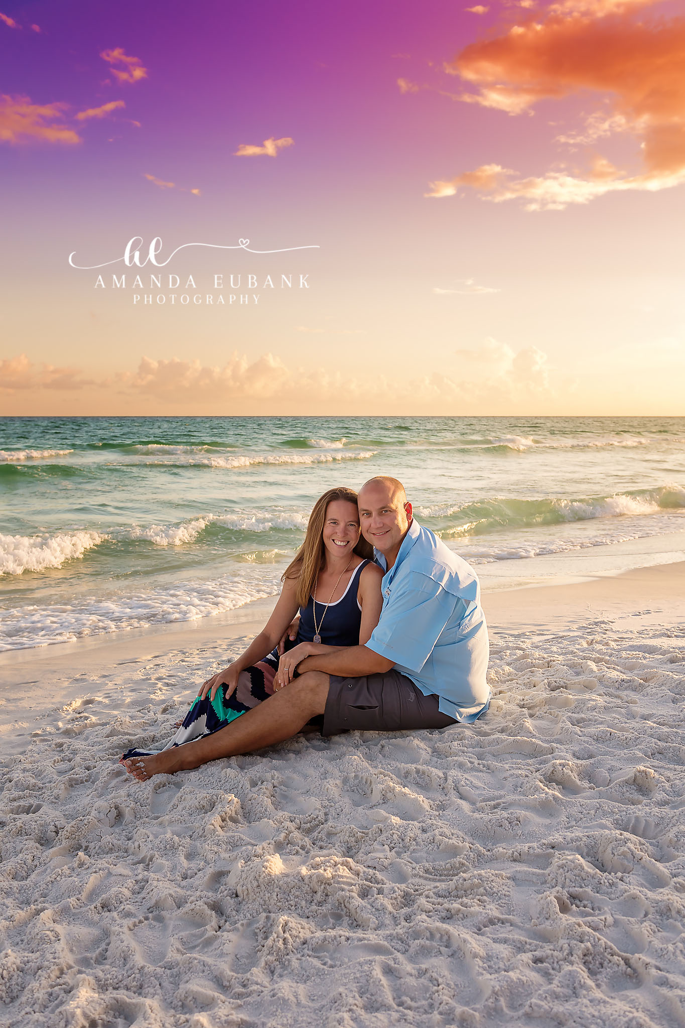 Mother and Daughter Wrapped Up | Tampa Family Photographer A mother and daughter wrapped in a blanket together on the sand at sunset during a Tampa family photography session.