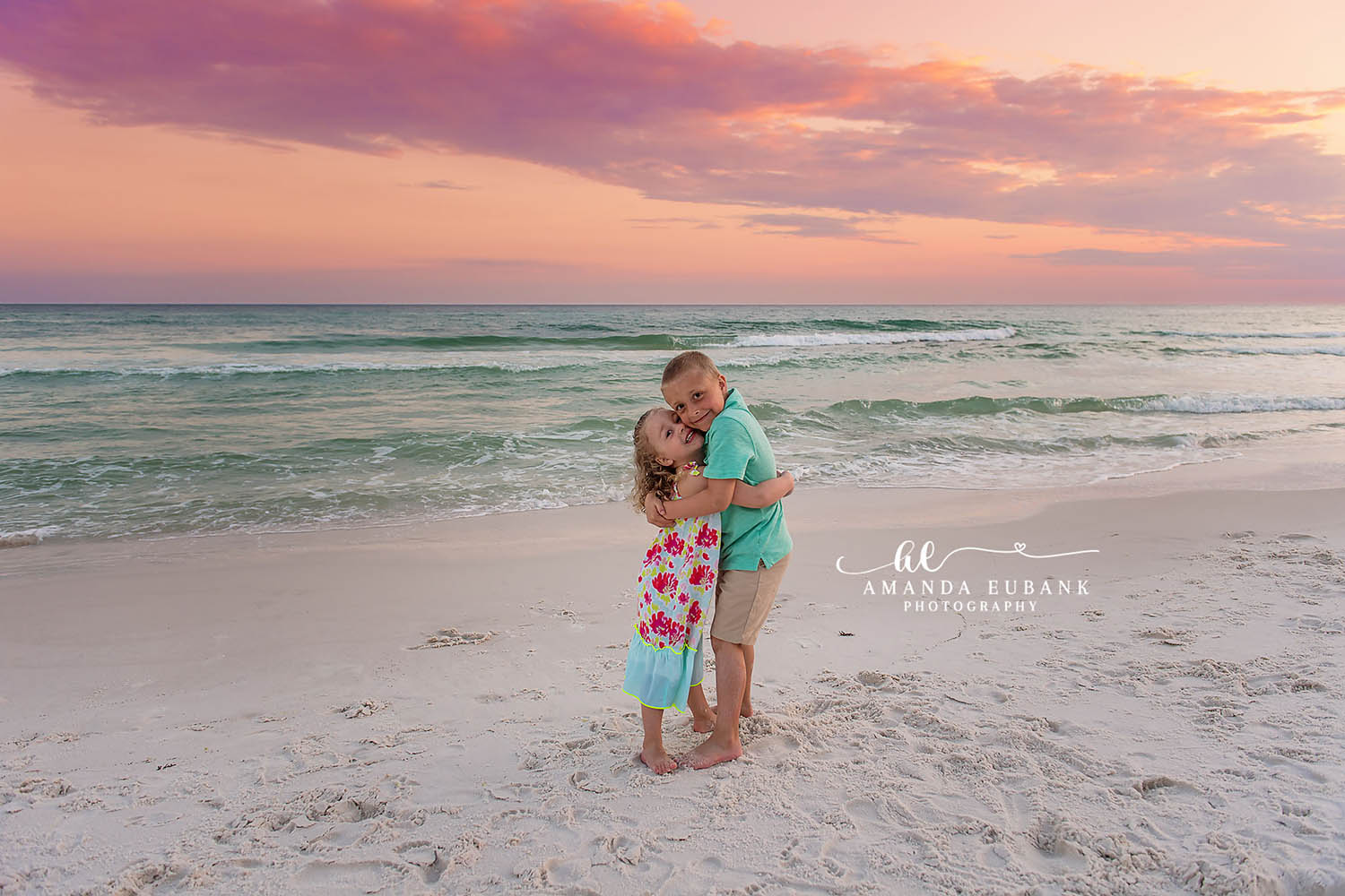 Mom and Daughter Hug — Tampa, FL Family Session A mother and daughter hugging on the beach in soft pastel evening light at a beach family session near Tampa, Florida.