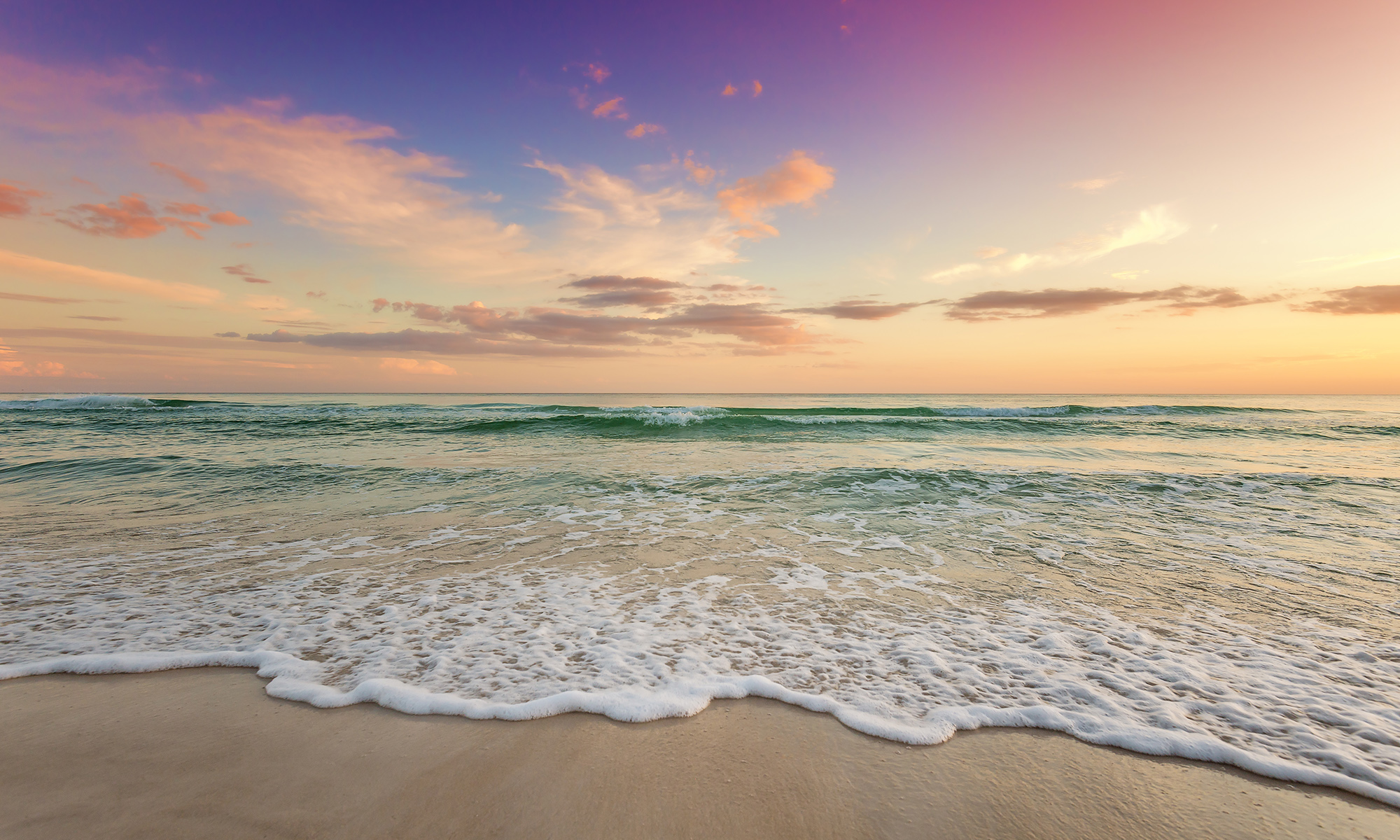Gentle Wave at Dusk — Gulf Coast Sunset near Tampa, FL Tampa beach photographer captures a gentle wave sliding onto white sand as emerald water catches the last light.