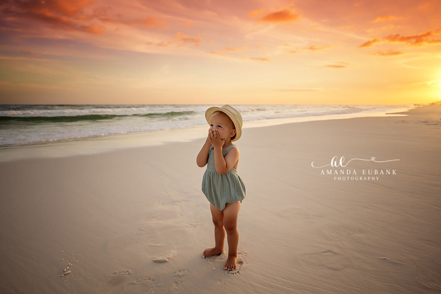 Girl in a Sun Hat — Tampa Bay Children’s Photography A little girl in a sun hat and green romper on the beach at golden hour at a beach kids session in Tampa, FL.