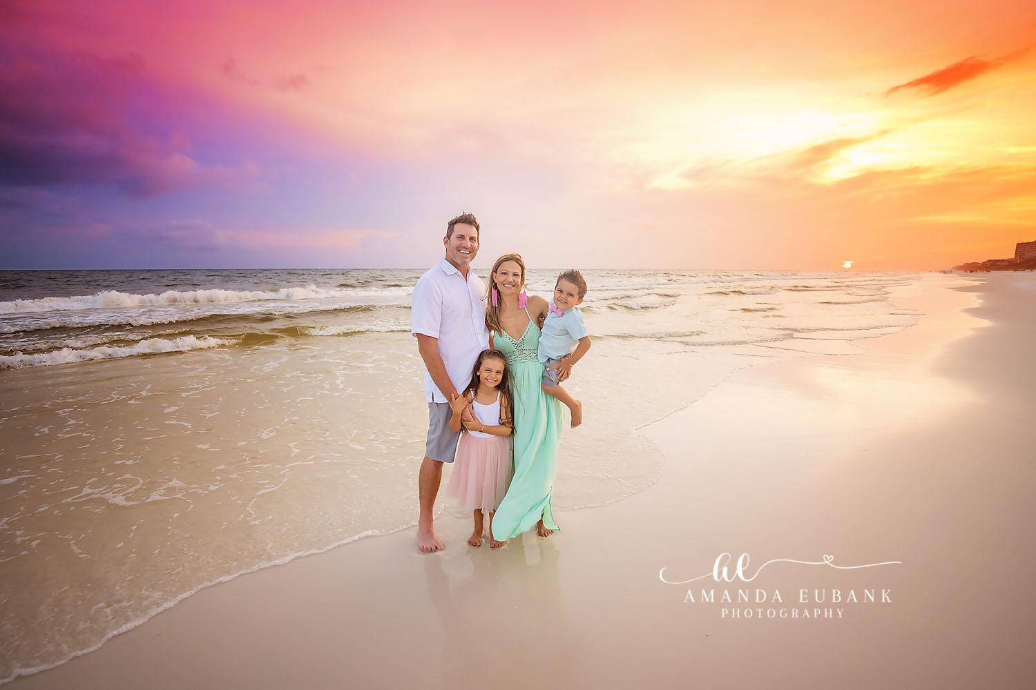 Mint Gown in the Shallows — Tampa, FL Family Session A family of four in the shallow water with mom in a mint gown at brilliant sunset at a beach family session near Tampa, Florida.