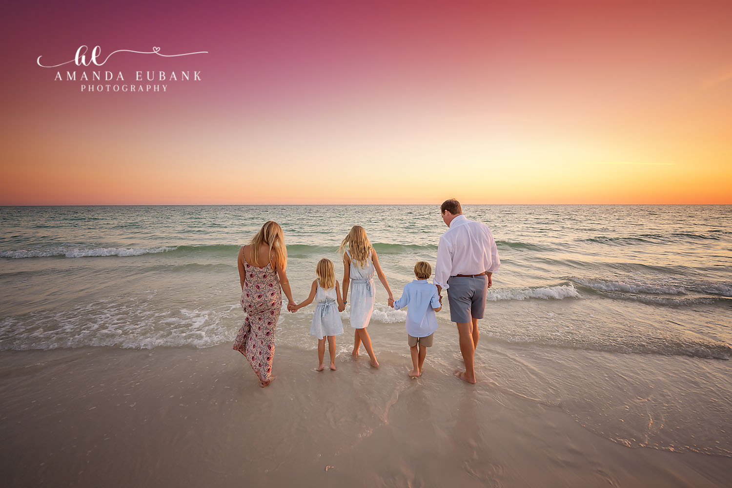 Family Walking Away at Sunset — Tampa Bay Family Portraits A family of five walking away along the shoreline in golden light — beach family photography in Tampa Bay.
