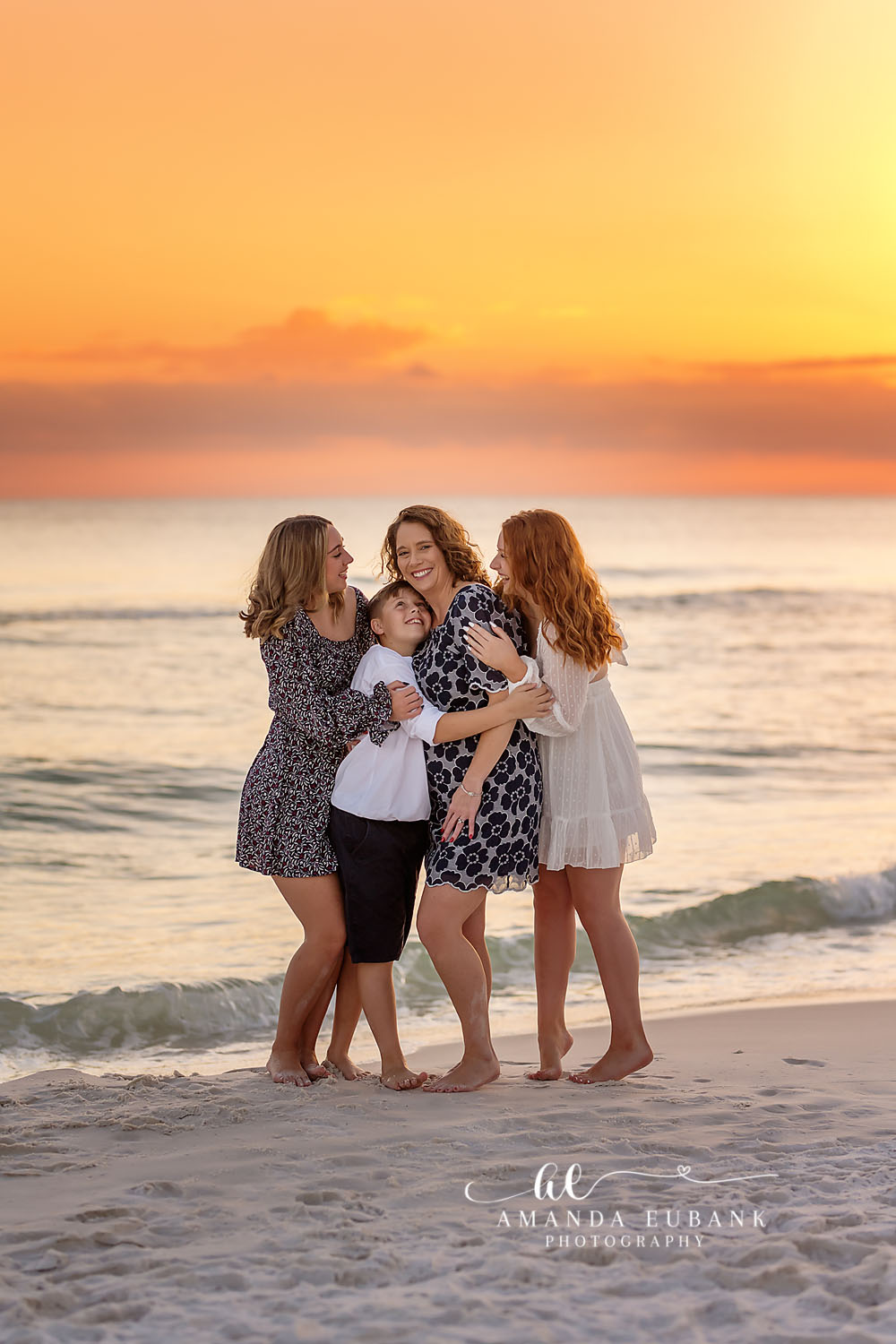 Three Generations of Women — Tampa, FL Family Session Three generations of women holding a baby on the beach at golden sunset at a beach family session near Tampa, Florida.