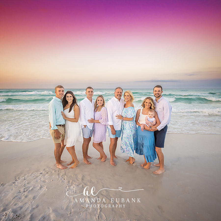 Extended Family in Blue and White | Large Family Beach Photos in Tampa, FL Tampa extended family photographer captures an extended family of nine standing in the shallow surf in blue and white.