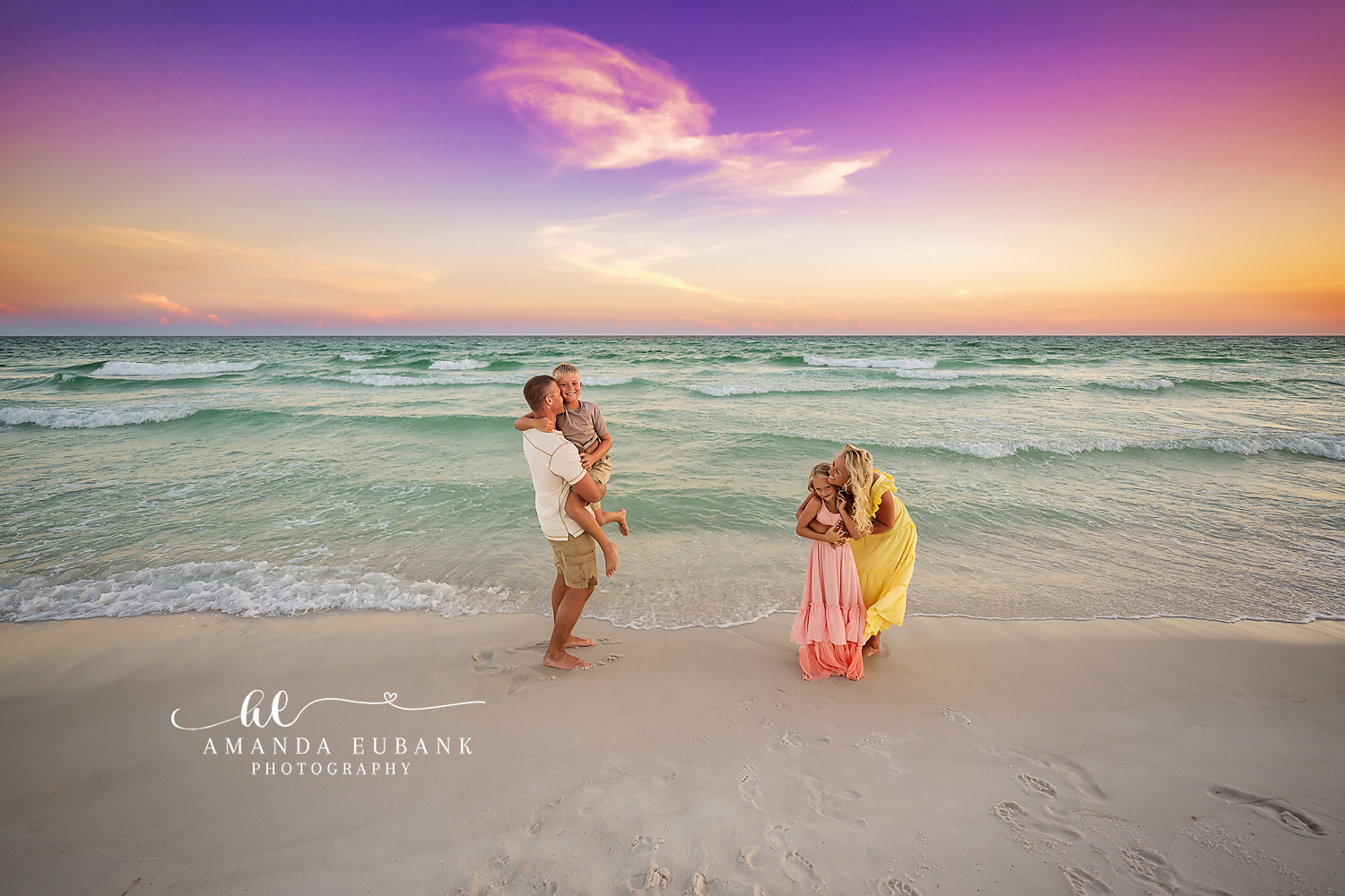 Family Playing at the Water’s Edge — Tampa, FL Family Session A family of five playing at the water's edge in coral and yellow at dusk at a beach family session near Tampa, Florida.