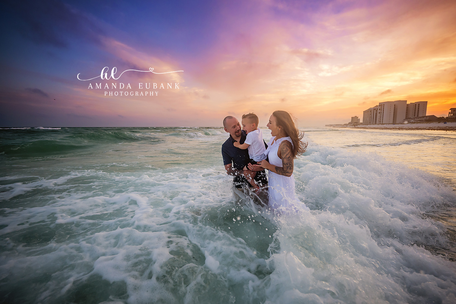 Family in the Surf at Sunset | Tampa Beach Family Photography Tampa family photographer captures a family of four laughing in the breaking surf as the sun sets behind the coast.