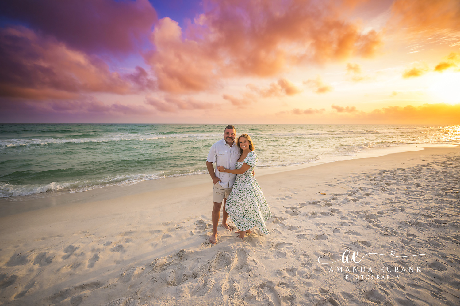 Family Portrait at the Shoreline — Tampa Bay Family Portraits A family of four on the shoreline in yellow and floral at golden hour — beach family photography in Tampa Bay.