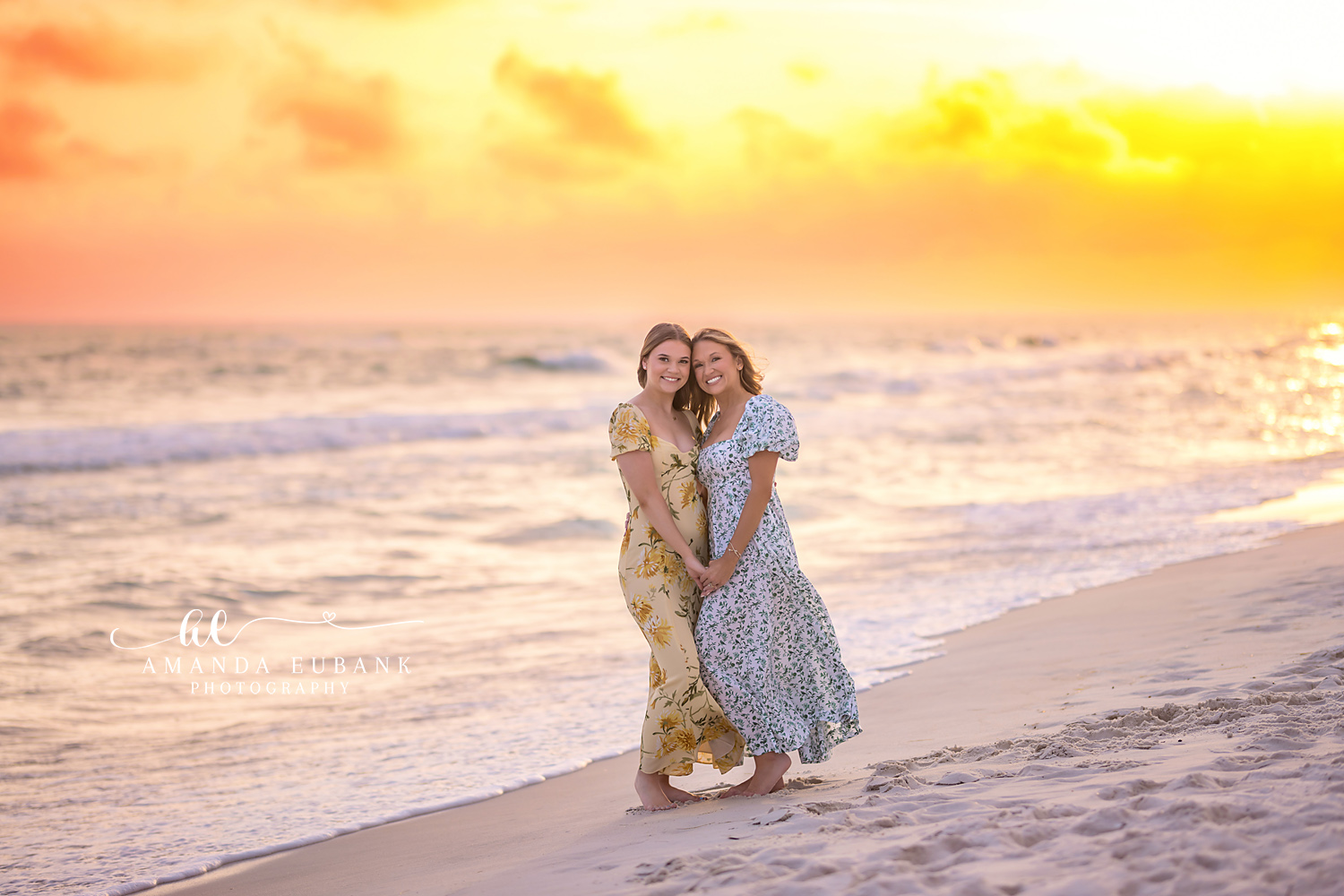 Mother and Daughter Embrace — Tampa, FL Family Session A mother and daughter holding each other on the sand under a golden sky at a beach family session near Tampa, Florida.