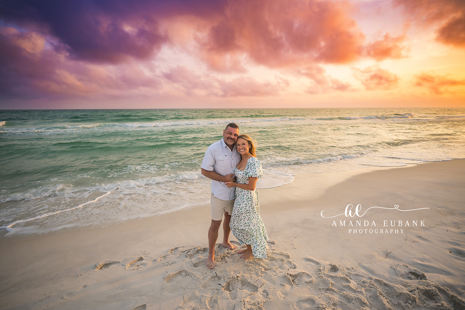 Parents at Golden Hour | Couples Photographer in Tampa, Florida Couples portraits in Tampa, FL showing a couple standing together on the sand as the sun sets over the Gulf.