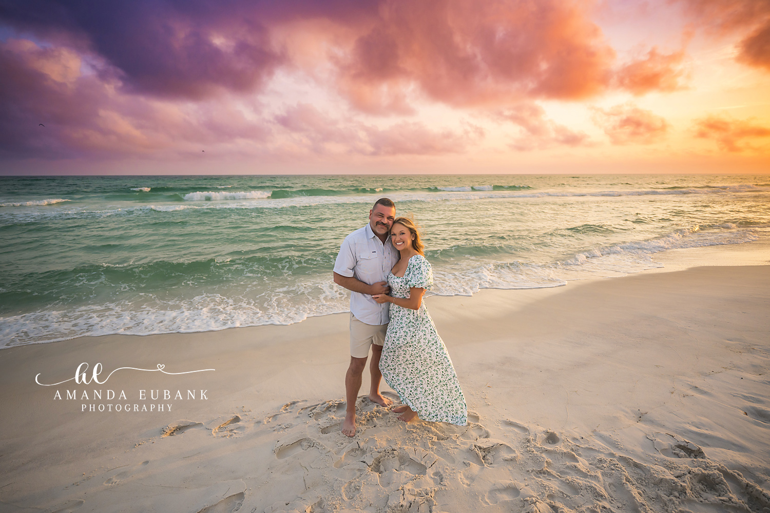 Couple in Yellow and White — Tampa Bay Couples Portraits A couple embracing on the beach in yellow and white as the sky turns gold — beach couples photography in Tampa Bay.