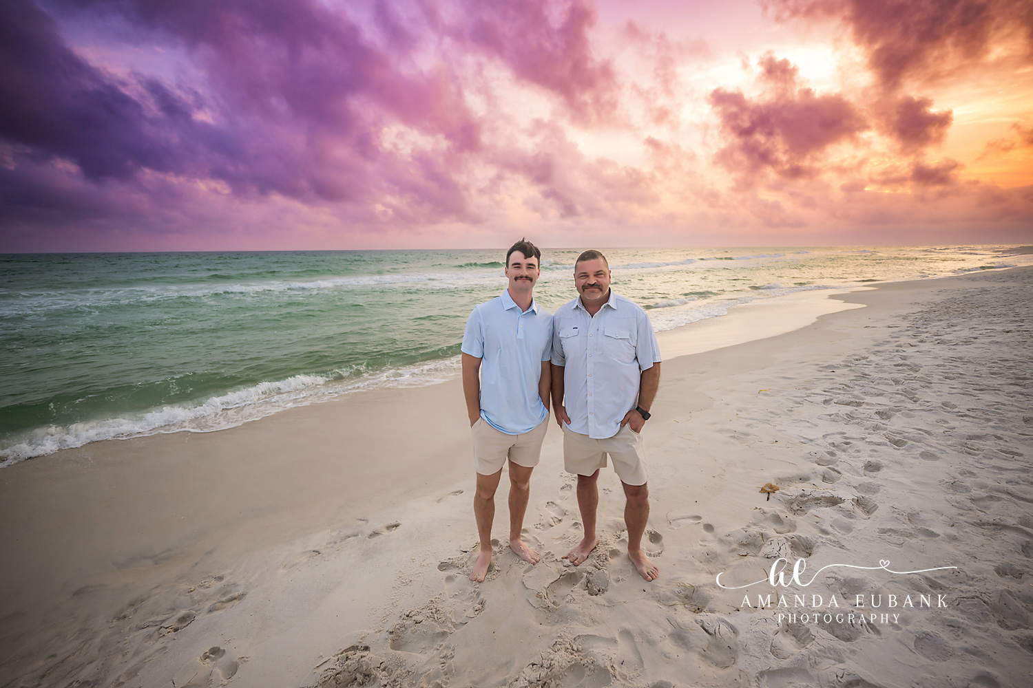 Brothers on the Shoreline | Tampa Children’s Photographer Two brothers standing side by side in the surf under a purple sky during a children’s portrait session in Tampa, Florida.