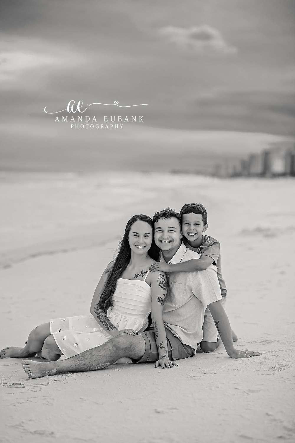 Black and White Couple on the Sand — Tampa, FL Couples Session A black and white frame of a couple sitting together on the beach at a beach couples session near Tampa, Florida.