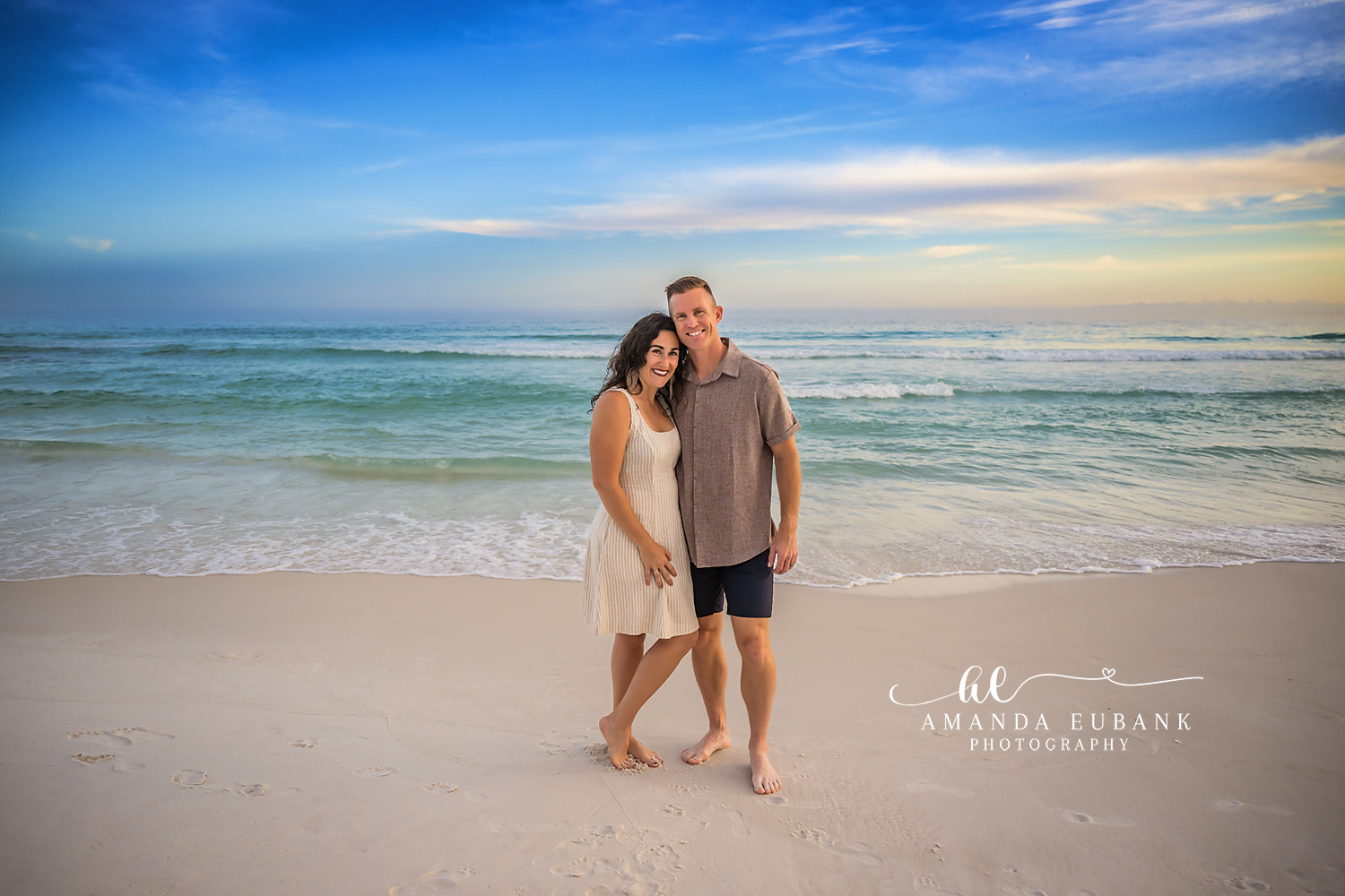 Couple on the Wet Sand at Dusk | Tampa Beach Couples Photography Tampa couples photographer captures a couple standing arm in arm on the wet sand in cream and gray at dusk.