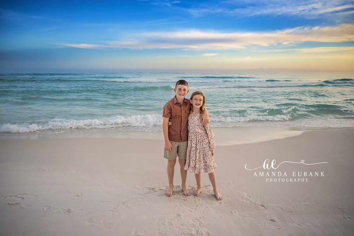 Father and Daughter on the Beach | Family Photographer in Tampa, Florida Family beach portraits in Tampa, FL showing a father and his daughter standing together on the sand under a wide blue sky.