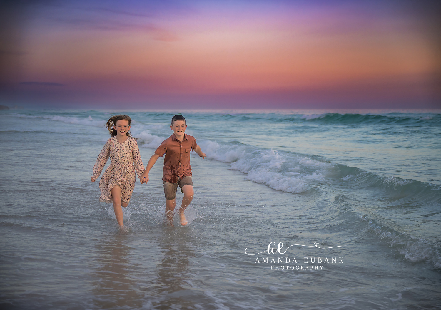 Siblings Running in the Shallows | Kids Beach Portraits in Tampa, FL Tampa children’s photographer captures a brother and sister running hand in hand through the shallow surf at dusk.