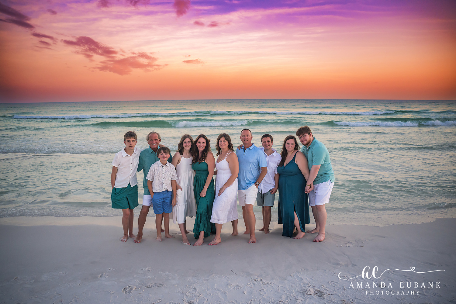 Extended Family in Teal and White — Tampa Bay Extended Family Session An extended family of twelve standing on the beach in teal and white at sunset at a large family beach session in Tampa, FL.