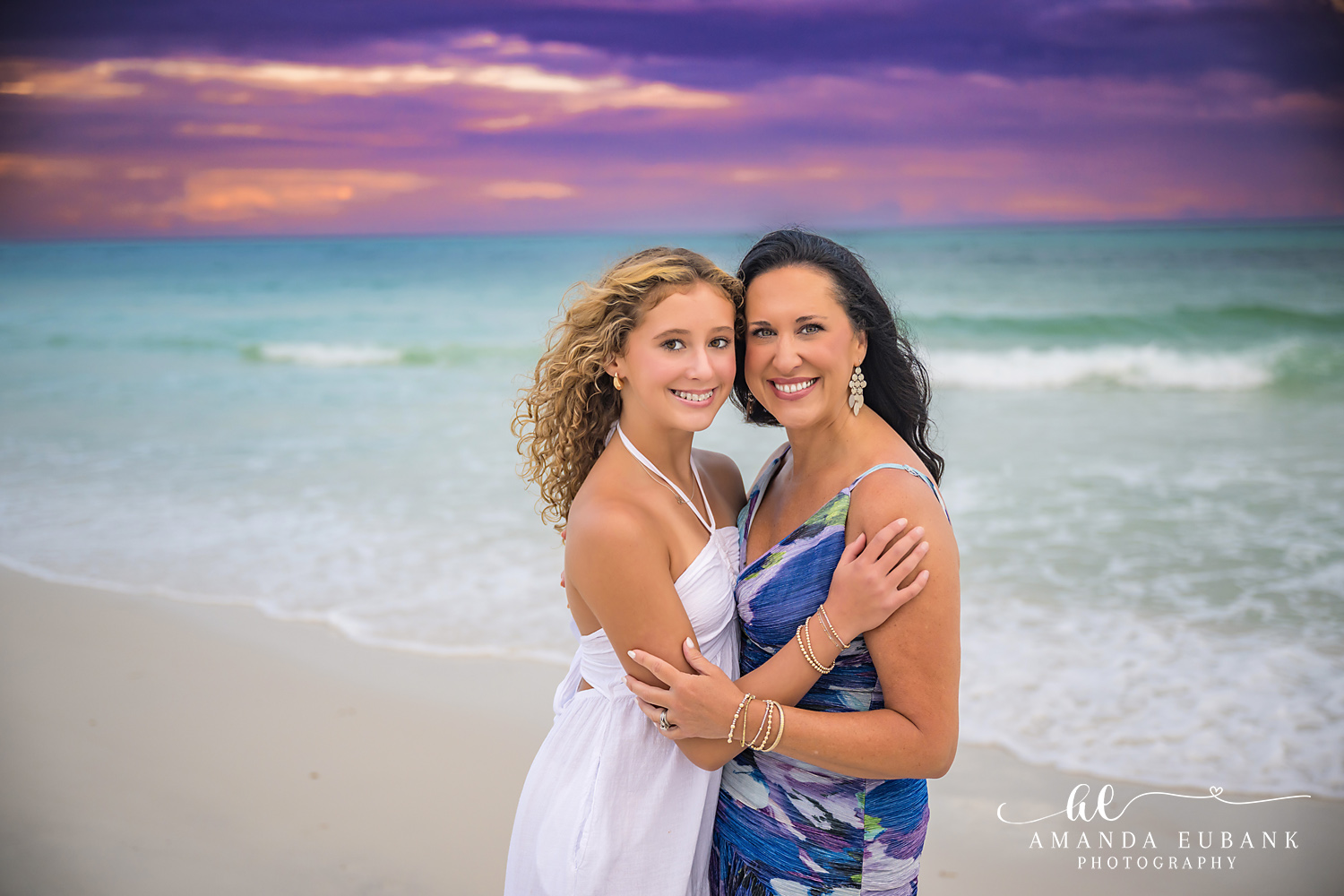 Mother and Teen Daughter | Tampa Beach Family Photography Tampa family photographer captures a mother and her teenage daughter embracing on the beach at pastel sunset.