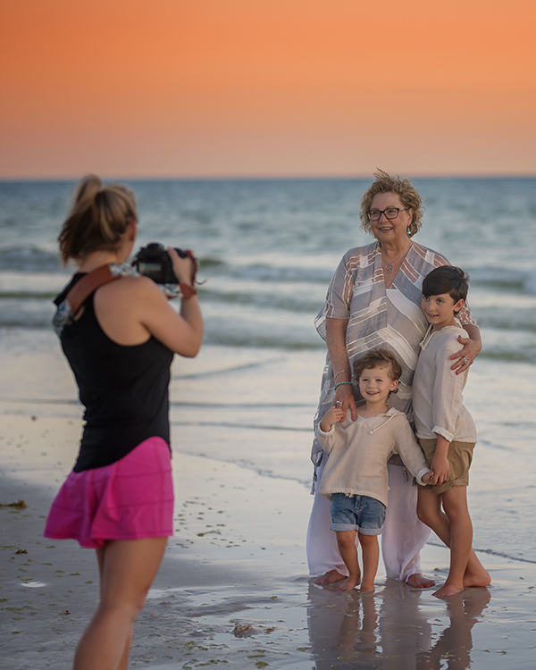 Photographing a Family at the Shoreline | Behind the Scenes in Tampa Behind the scenes of a photographer directing a mother and children at the shoreline during a Tampa beach session.