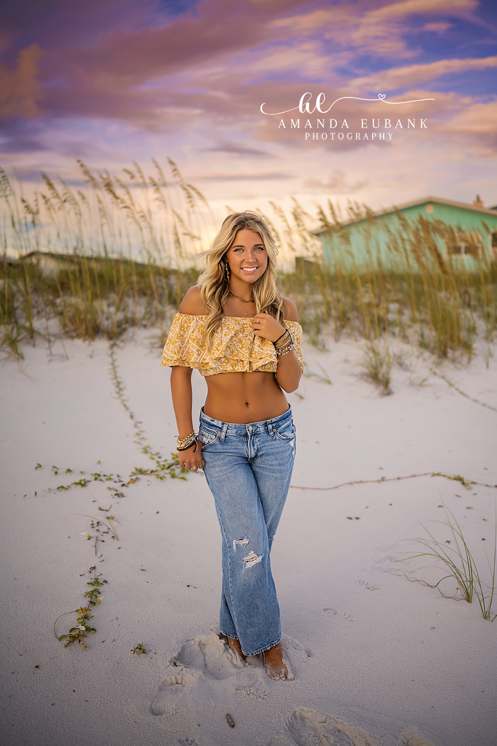 Dune Grass Senior Portrait | Senior Portraits in Tampa, FL Tampa senior photographer captures a senior in a yellow top and jeans standing in the dune grass at sunset.