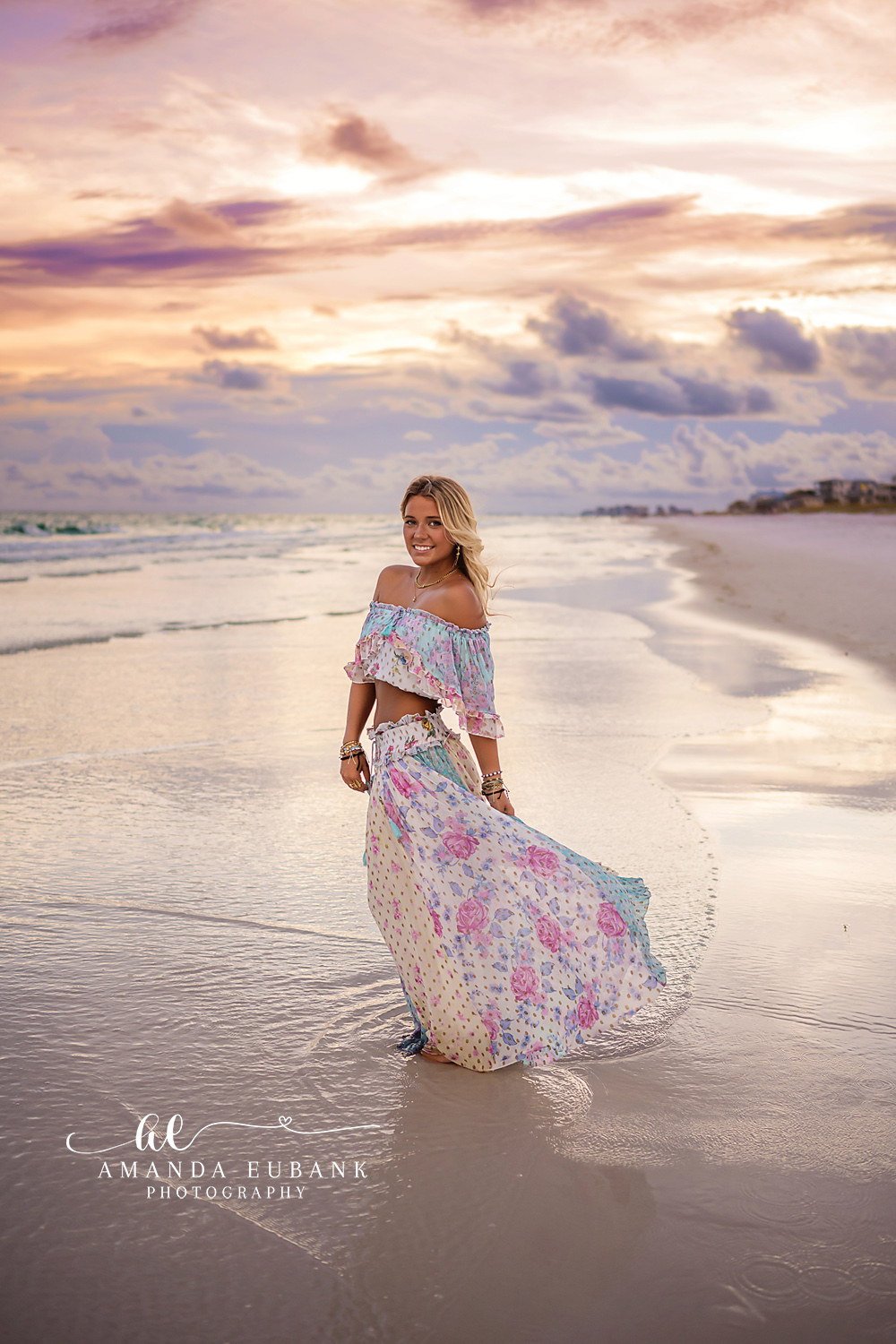 Walking in a Floral Skirt | Senior Portraits in Tampa, FL Tampa senior photographer captures a senior walking the shoreline as her floral skirt trails across the water.