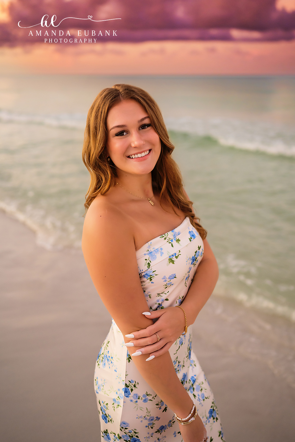 Close Portrait in Florals | Tampa Senior Photographer A close portrait of a senior in a white floral dress on the beach at dusk during a senior portrait session in Tampa, Florida.