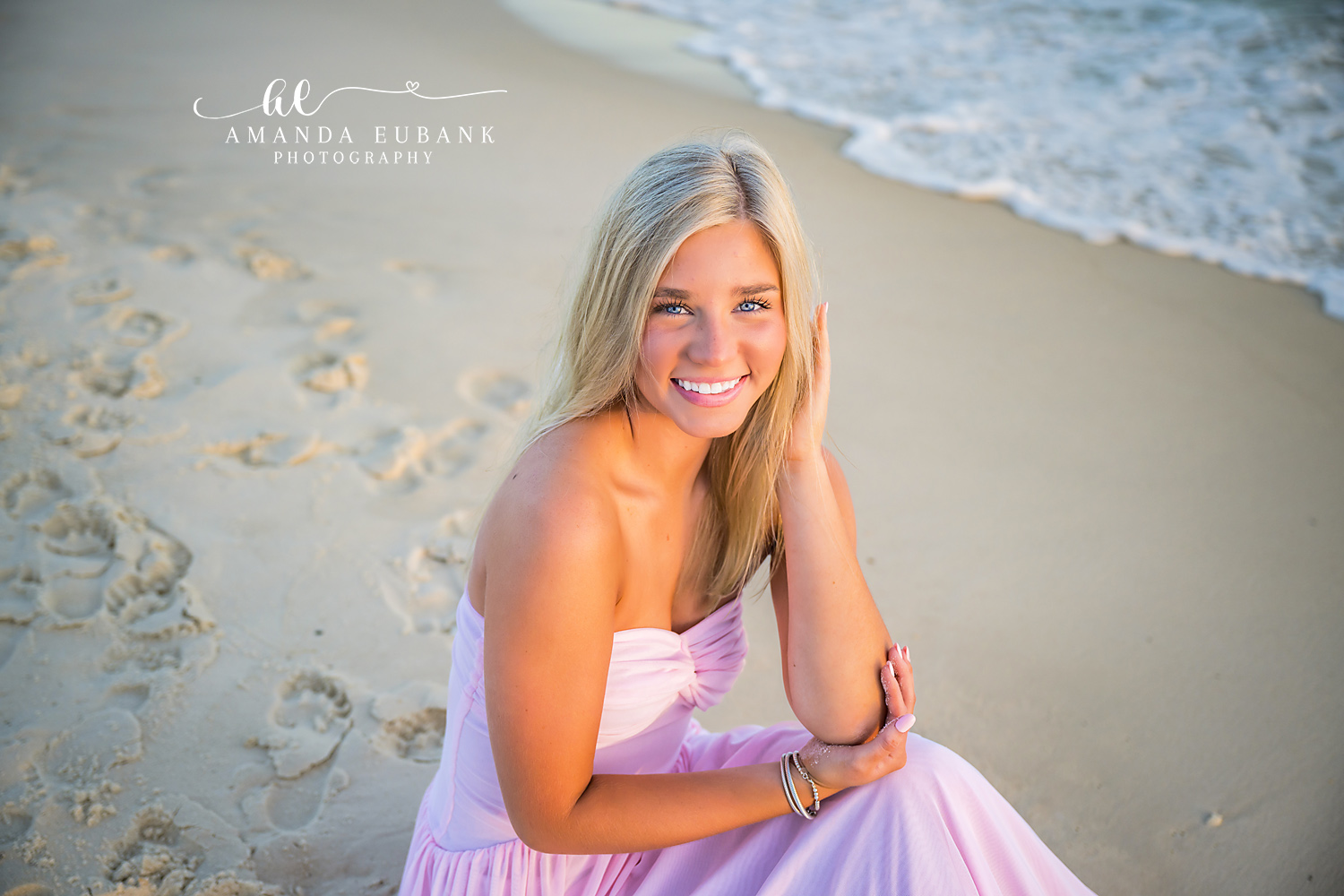 Lavender Gown Close-Up — Tampa Bay Senior Photography A close portrait of a smiling senior in a lavender gown on the beach at a beach senior session in Tampa, FL.