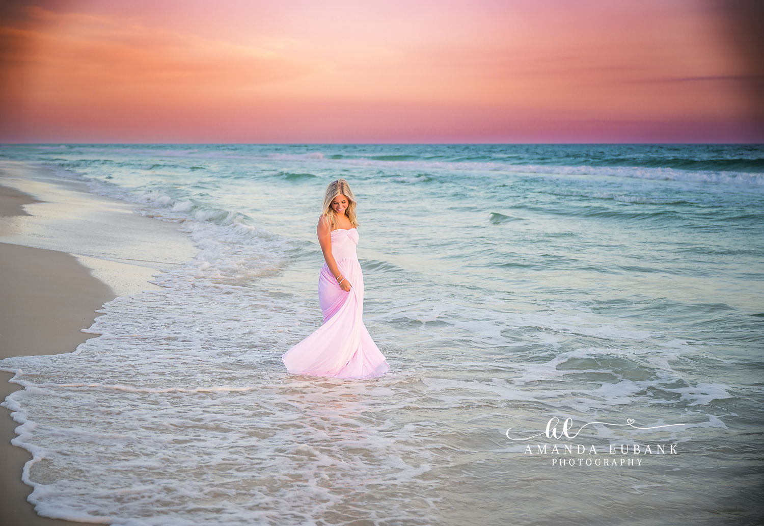 Pink Gown in the Sea Foam | Senior Portraits in Tampa, FL Tampa senior photographer captures a senior in a pink gown standing in swirling sea foam at pastel sunset.