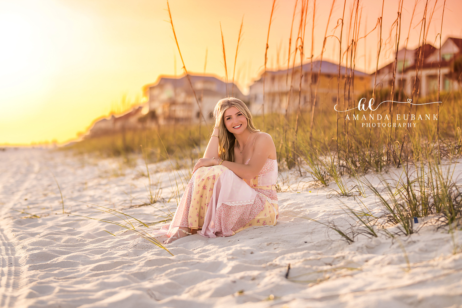 Seated in the Golden Dunes — Tampa Bay Senior Photography A senior in a blush gown seated in the dunes as the sun floods the sea oats at a beach senior session in Tampa, FL.