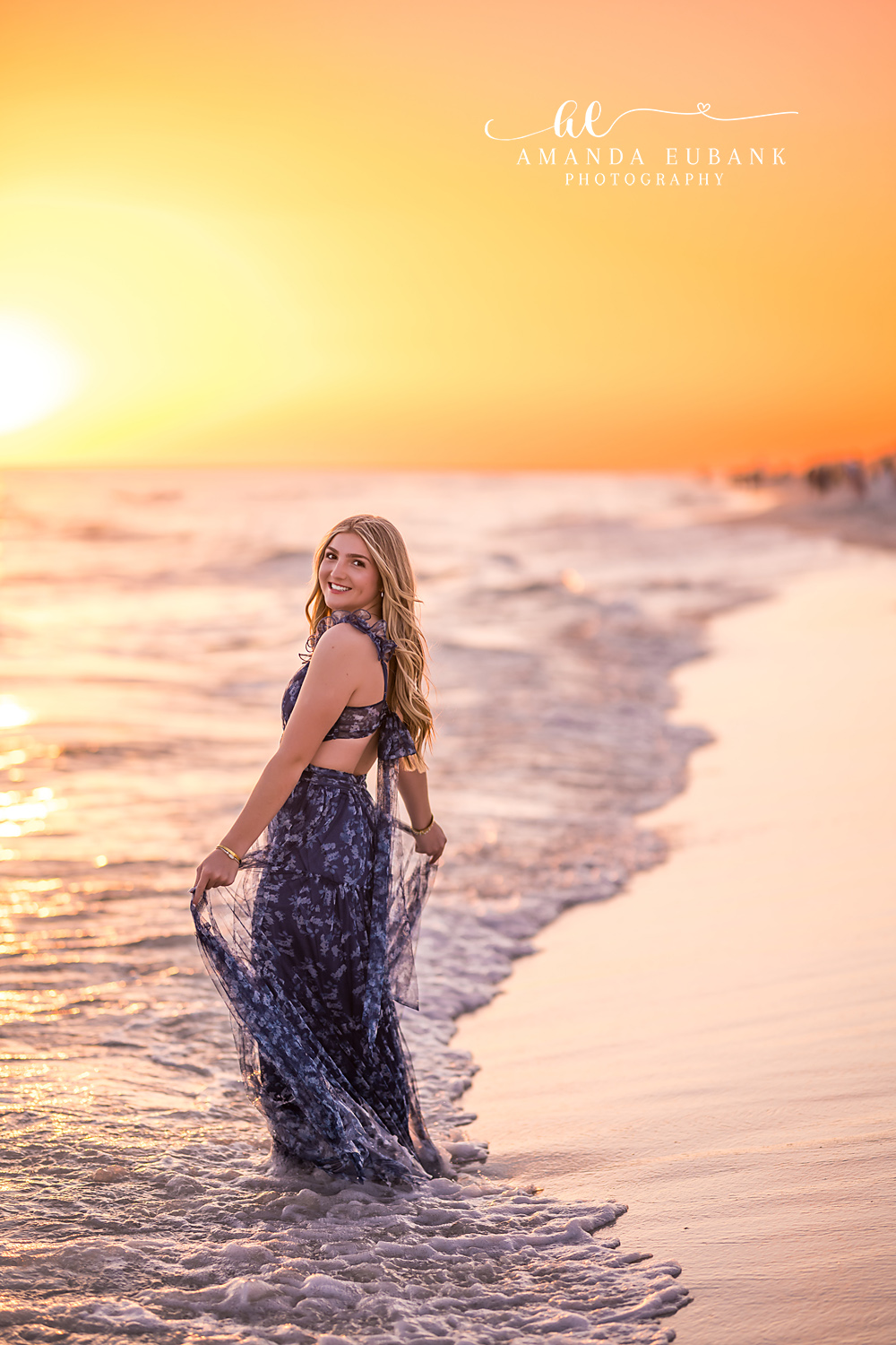 Navy Gown on the Wet Sand — Tampa Bay Senior Photography A senior in a navy gown on the wet sand in warm golden sunset light at a beach senior session in Tampa, FL.