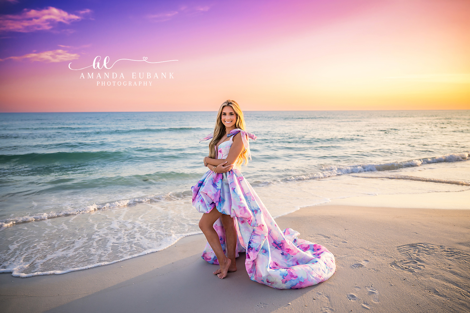 Gown Train in the Surf | Senior Portraits in Tampa, FL Tampa senior photographer captures a senior in a printed gown with the train trailing in the shallow surf.