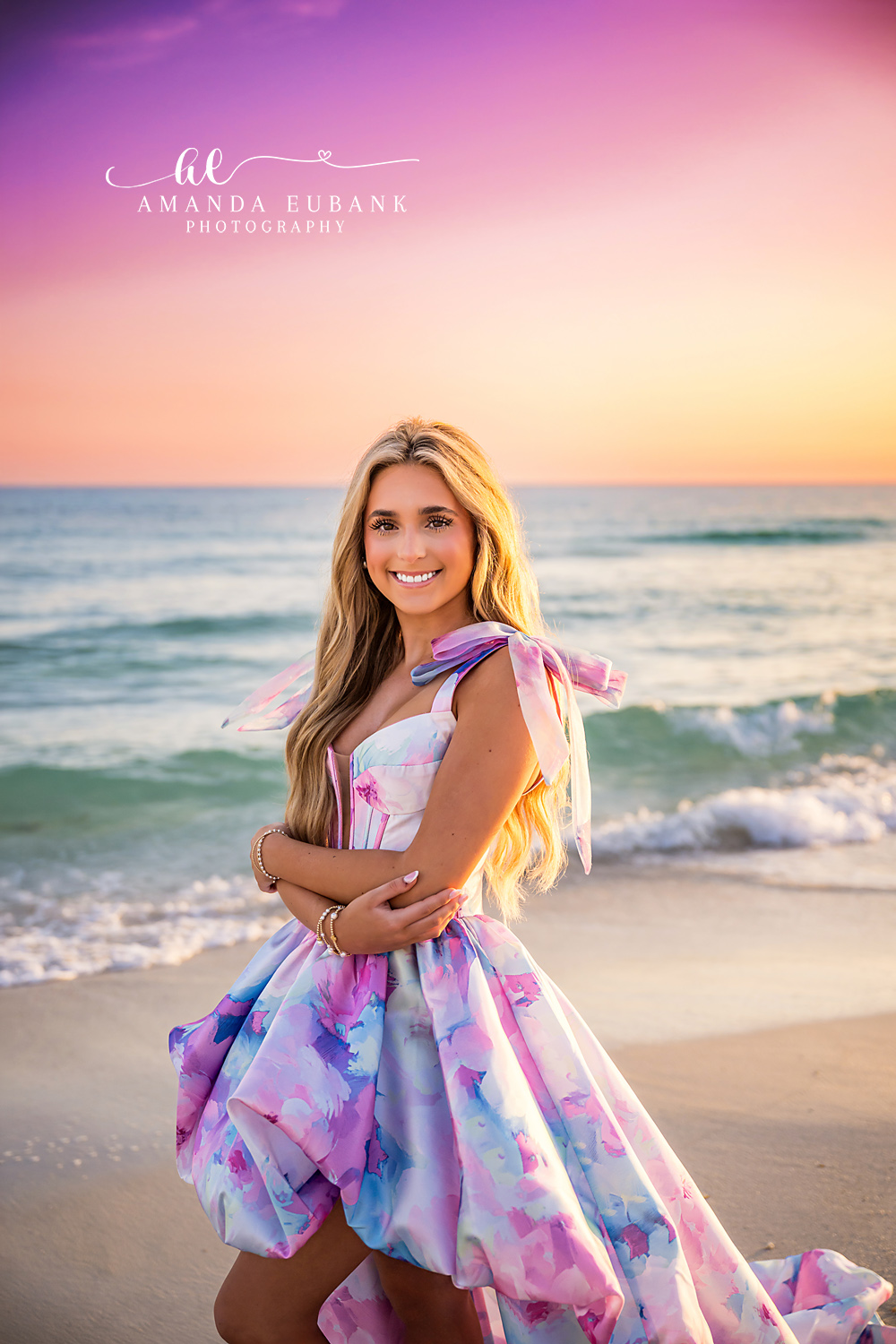 Printed Gown Close-Up — Tampa Bay Senior Photography A close portrait of a senior in a printed gown beneath a pastel sunset sky at a beach senior session in Tampa, FL.